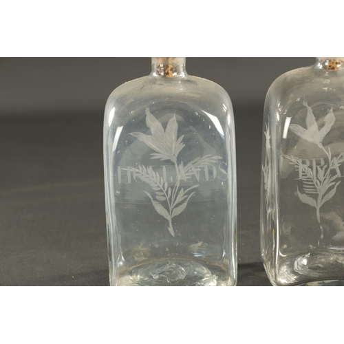 17 - A PAIR OF GEORGIAN RECTANGULAR SPIRIT DECANTERS with engraved labels and flower sprays, and a set of... 