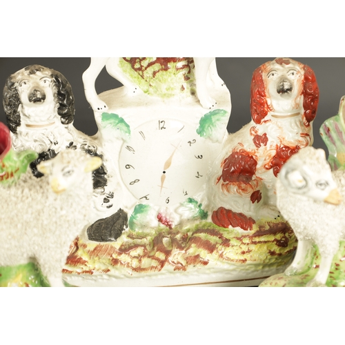 170 - A STAFFORDSHIRE CLOCK GROUP OF SPANIELS AND POODLE fox group TOGETHER WITH A STAFFORDSHIRE SPILL VAS... 