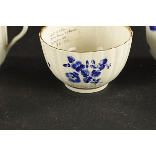 173 - A WORCESTER PORCELAIN FLUTED TRIO DECORATED WITH DRY BLUE FLOWERS CIRCA 1775 together with A SIMILAR... 