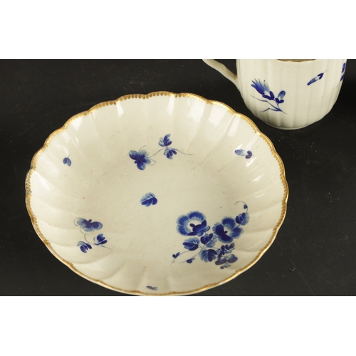 173 - A WORCESTER PORCELAIN FLUTED TRIO DECORATED WITH DRY BLUE FLOWERS CIRCA 1775 together with A SIMILAR... 