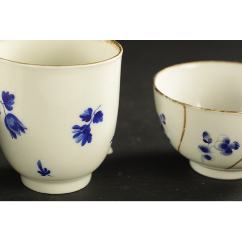 173 - A WORCESTER PORCELAIN FLUTED TRIO DECORATED WITH DRY BLUE FLOWERS CIRCA 1775 together with A SIMILAR... 