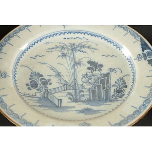 179 - A PAIR OF BRISTOL DELFT PLATES CIRCA 1760 AND A PAIR OF LIVERPOOL DELFT PLATES (23cm diameter)