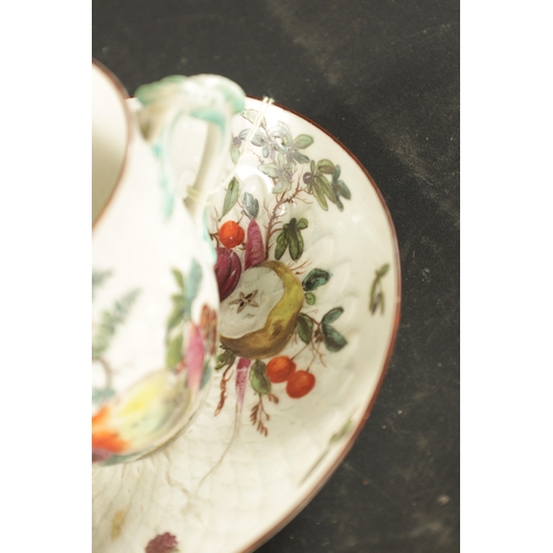 181 - A MID 18TH CENTURY CHELSEA PORCELAIN TWO HANDLED CUP AND STAD painted with fruit (15cm diameter)