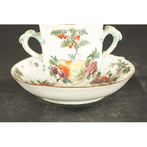 181 - A MID 18TH CENTURY CHELSEA PORCELAIN TWO HANDLED CUP AND STAD painted with fruit (15cm diameter)