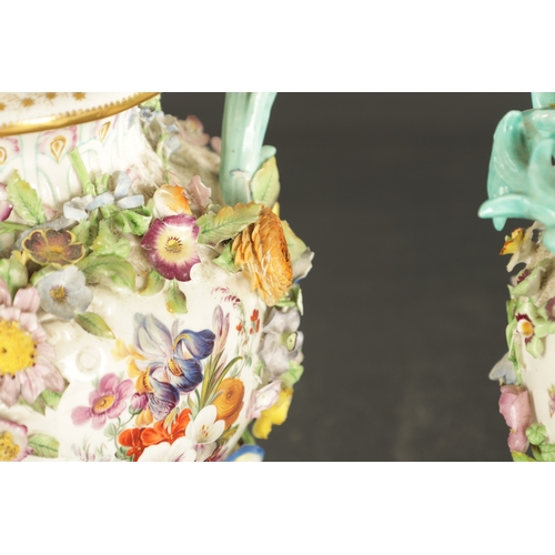 185 - A PAIR OF MID 19TH CENTURY MINTON PORCELAIN JARS AND COVERS encrusted with flowers (28cm high)