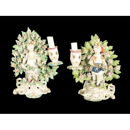 186 - A PAIR OF LATE 19TH CENTURY DERBY BOCAGE CANDLESTICK FIGURES of a boy and a girl (20cm high)