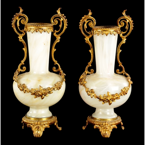 20 - A PAIR OF LATE 19TH CENTURY OPAQUE GLASS AND ORMOLU MOUNTED VASES with floral leaf decoration (23cm ... 