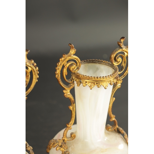 20 - A PAIR OF LATE 19TH CENTURY OPAQUE GLASS AND ORMOLU MOUNTED VASES with floral leaf decoration (23cm ... 