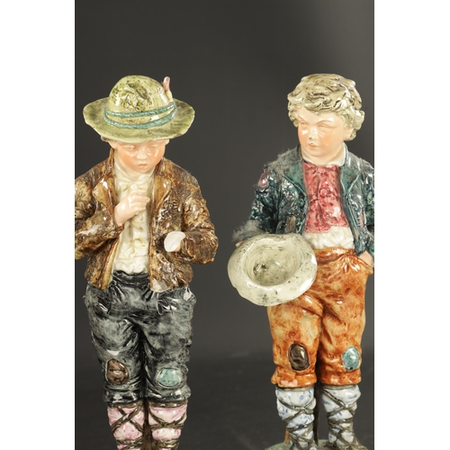 200 - A PAIR OF LATE 19TH CENTURY ROYAL DUX FIGURES OF BOYS along with THREE PAIRS OF CONTINENTAL FIGURES ... 