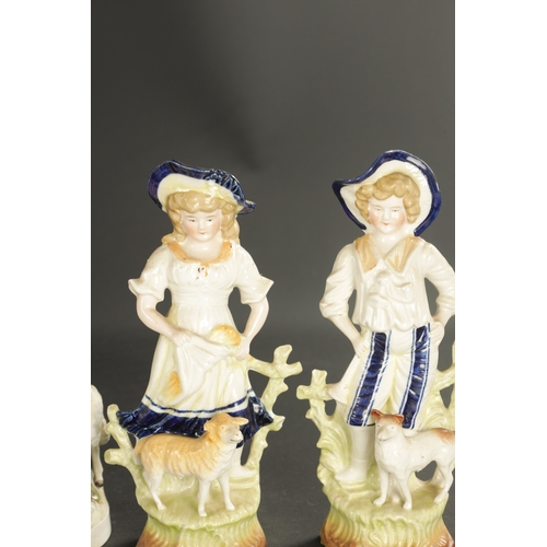 200 - A PAIR OF LATE 19TH CENTURY ROYAL DUX FIGURES OF BOYS along with THREE PAIRS OF CONTINENTAL FIGURES ... 