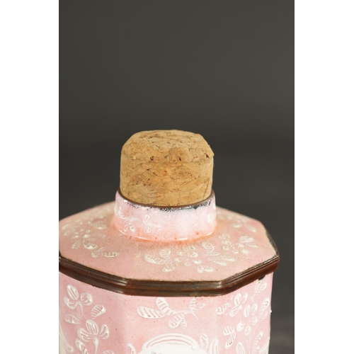 202 - A LATE 18TH CENTURY BILSTON ENAMEL TEA CADDY on a pink ground with floral spray panels (13cm high)