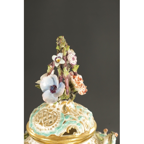 212 - AN EARLY 19TH CENTURY MINTON PORCELAIN VASE IN THE MEISSEN STYLE PAINTED WITH FLOWERS (42cm high)