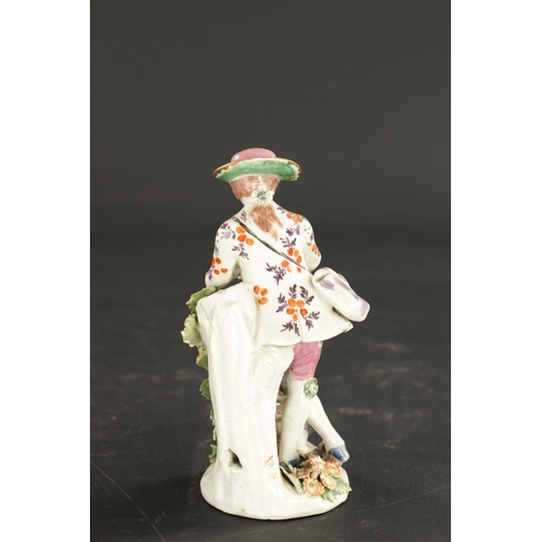 218 - A MID 18TH CENTURY BOW PORCELAIN FIGURE OF A PIPPING SHEPHERD with anchor and dagger mark (15cm high... 