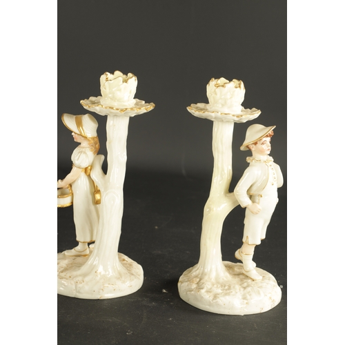 248 - A PAIR OF ROYAL WORCESTER CANDLESTICKS modelled by James Hadley circa 1870, along with a MINTON PORC... 