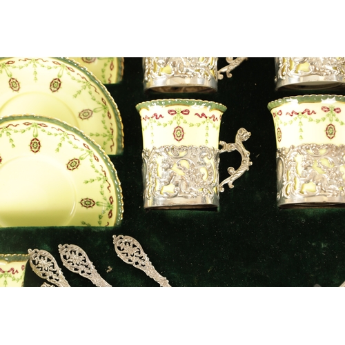 254 - A CASED ROYAL WORCESTER SIX PIECE COFFEE SERVICE WITH SILVER PLATED CUPHOLDERS AND SPOONS yellow gro... 