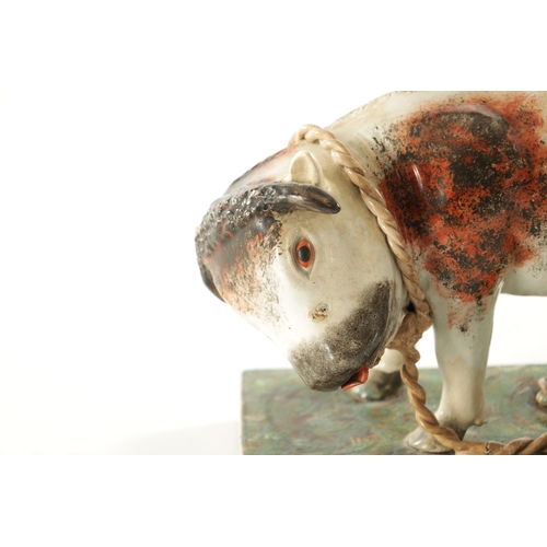 266 - A 19TH CENTURY STAFFORDSHIRE BULL BAITING GROUP with polychrome colours (31cm wide 22cm high )