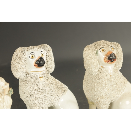 269 - TWO PAIRS OF STAFFORDSHIRE POODLES AND A PAIR OF LATE SPANIELS, and a pair of figures of a boy and g... 