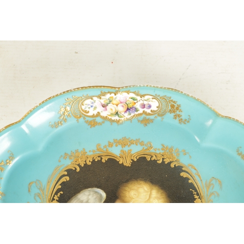 282 - A MID 19TH CENTURY MINTON PORCELAIN TRAY painted a cherub holding a dove (32cm across)