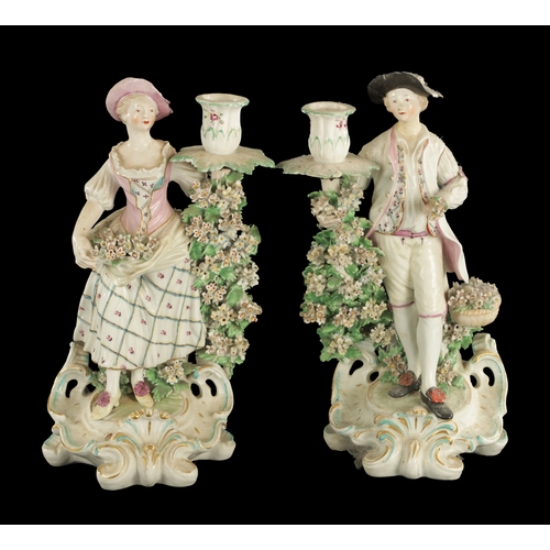 283 - A PAIR OF MID 18TH CENTURY DERBY CANDLESTICK FIGURES male and female companions (27cm high)