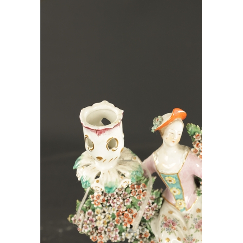 299 - A PAIR OF MID 18TH CENTURY DERBY PORCELAIN BOCAGE CANDLESTICK FIGURES of a man and woman drinking (2... 