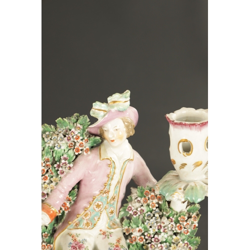 299 - A PAIR OF MID 18TH CENTURY DERBY PORCELAIN BOCAGE CANDLESTICK FIGURES of a man and woman drinking (2... 