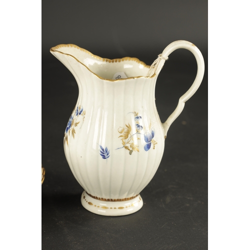 301 - A RARE CAUGHLEY PORCELAIN TRIO CIRCA 1780 decorated with gilt swags TOGETHER WITH A SIMILAR CREAM JU... 