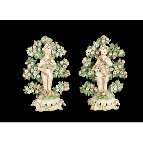 308 - A PAIR OF MID 18TH CENTURY BOW BOCAGE FIGURES OF PUTTI with anchor and dagger mark (20cm high)