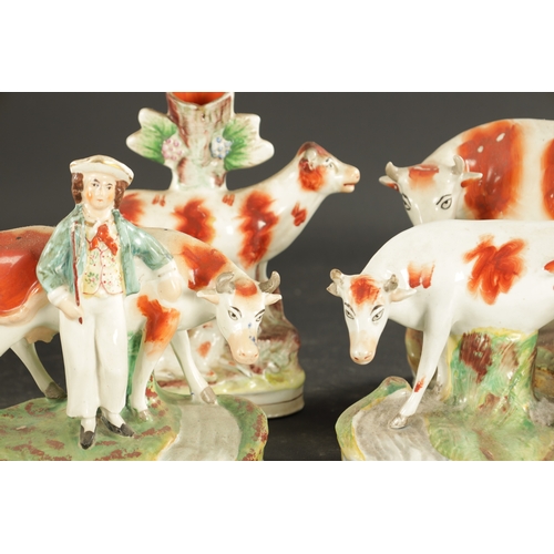 310 - A COLLECTION OF SEVEN MID 19TH CENTURY STAFFORDSHIRE PORCELAIN FIGURAL COW GROUPS (19cm high and sma... 