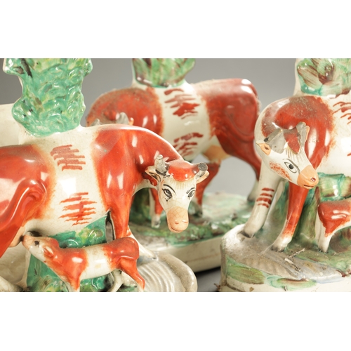 312 - TWO PAIRS OF STAFFORDSHIRE SPILL VASES WITH COWS AND CALVES CIRCA 1870, ALONG WITH TWO SIMILAR FIGUR... 