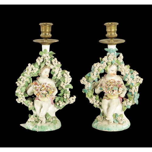 316 - A PAIR OF MID 18TH CENTURY DERBY PORCELAIN CANDLESTICKS of cherubs (26cm high )