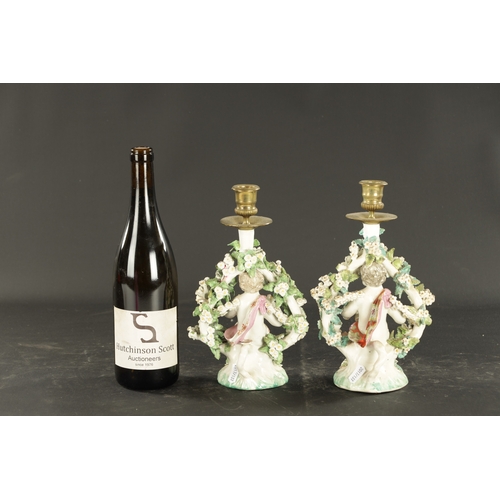 316 - A PAIR OF MID 18TH CENTURY DERBY PORCELAIN CANDLESTICKS of cherubs (26cm high )