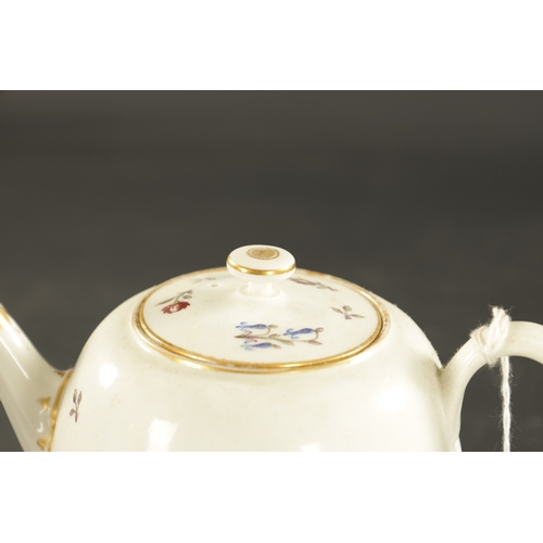 317 - A LATE 18TH CENTURY WORCESTER PORCELAIN TEAPOT painted with flowers (13cm high)