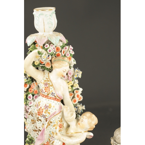 32 - TWO MID 18TH CENTURY DERBY PORCELAIN FIGURE GROUPS one of two putti, the other a candlestick figure ... 