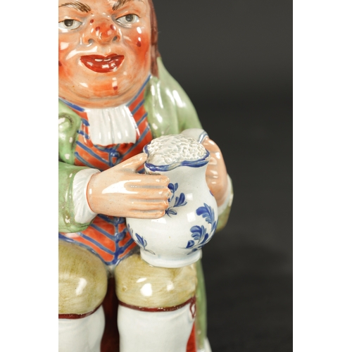 322 - AN EARLY 19TH CENTURY WALTON TOBY JUG (26.5cm high)