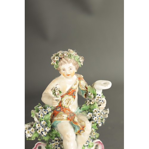 330 - TWO MID 18TH CENTURY DERBY FIGURES OF CHERUBS TOGETHER WITH A SINGLE FIGURE CHAMBERSTICK OF A CHERUB... 