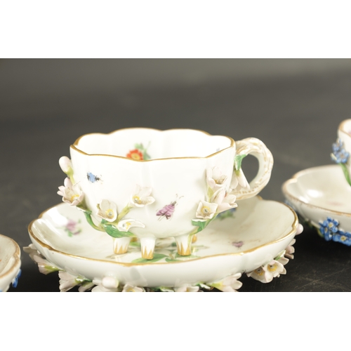 34 - THREE MID 19TH CENTURY MEISSEN PORCELAIN CUP AND SAUCERS encrusted and painted with flowers and inse... 