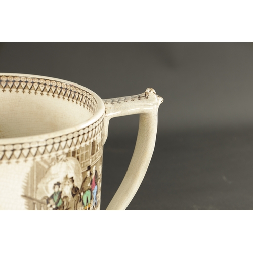 369 - A LARGE NORTH EAST POTTERIES LOVING CUP PRINTED AND PAINTED WITH DICKENSIAN CHARACTERS (20cm high 32... 