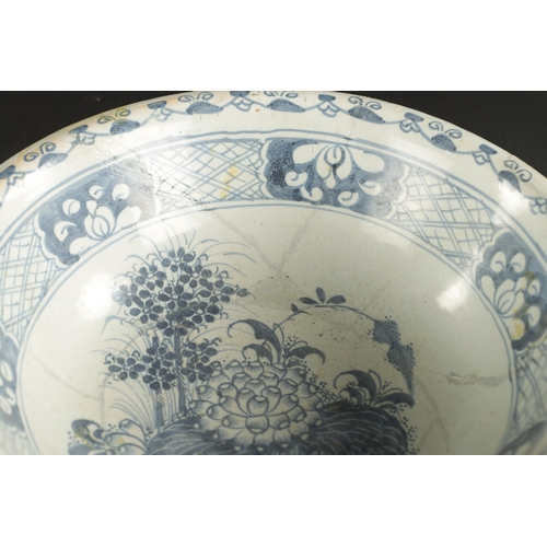 374 - A MID 18TH CENTURY LIVERPOOL DELFT CHARGER AND A BOWL (34cm diameter and smaller)