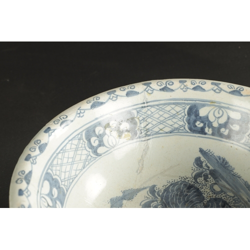 374 - A MID 18TH CENTURY LIVERPOOL DELFT CHARGER AND A BOWL (34cm diameter and smaller)