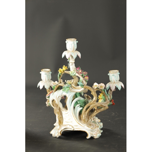 376 - A 19TH CENTURY MEISSEN THREE BRANCH FIGURAL CANDELABRA (30cm high)