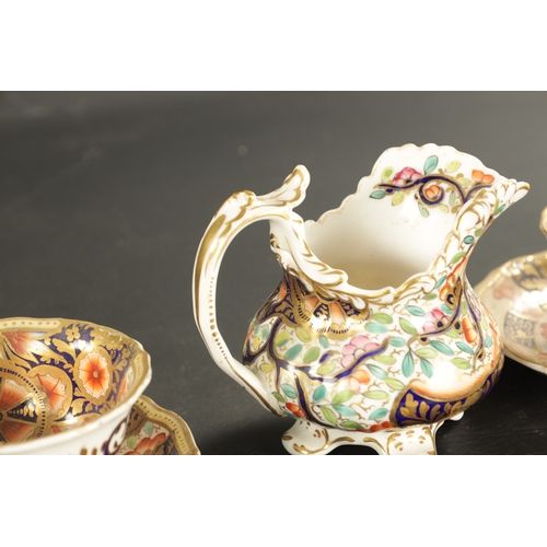 380 - TWO ENGLISH PORCELAIN TRIOS AND A CREAM JUG CIRCA 1840 painted in imari colours with flowering plant... 