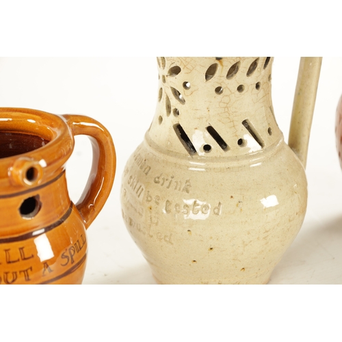 394 - TWO LATE 19TH CENTURY STONEWARE PUZZLE JUGS along with Lostweithel puzzle jug (22cm high and smaller... 