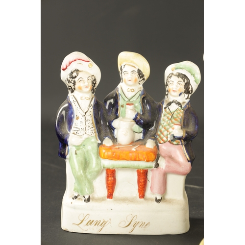 40 - A COLLECTION OF ENGLISH PORCELAIN a Staffordshire figure group old land syne, and a group of smith a... 