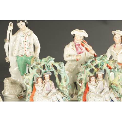 40 - A COLLECTION OF ENGLISH PORCELAIN a Staffordshire figure group old land syne, and a group of smith a... 