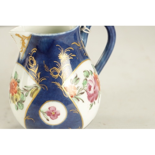 405 - A WORCESTER SPARROW BEAK JUG painted with flowers on an underglaze blue ground (8.8cm high)