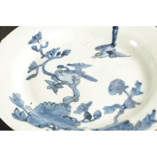 411 - A NANKING CARGO CHINESE PORCELAIN DISH painted in blue with a river landscape along with A SOWANKALO... 