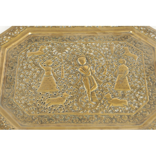 412 - A 19TH CENTURY INDIAN ENGRAVED BRASS TWO-HANDLED TRAY with a peacock centre and a similar pierced br... 