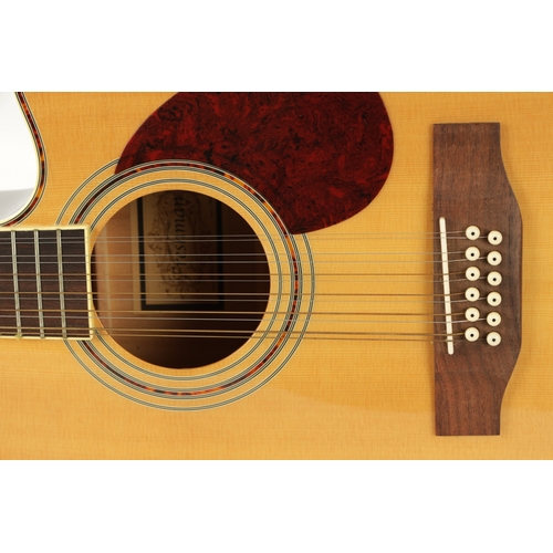 418 - A FRESHMAN TWELVE STRING ACOUSTIC GUITAR AND A MAHALO UKULELE the guitar with faux tortoiseshell inl... 