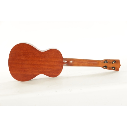 418 - A FRESHMAN TWELVE STRING ACOUSTIC GUITAR AND A MAHALO UKULELE the guitar with faux tortoiseshell inl... 