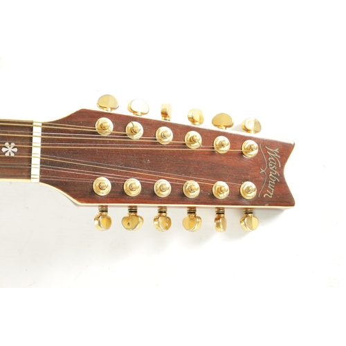 429 - A TWELVE STRING WASHBURN ACOUSTIC GUITAR with a spruce top and rosewood back. (109cm long)